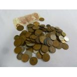 A quantity of British coins and a ten shilling bank note, approx 800g