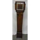 A 1930's oak Grandmother clock three train movement, silvered dial, Roman numerals, to include key