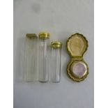 Silver and enamel compact in fitted case and three dressing table bottles with silver covers