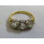 18ct yellow gold three stone diamond ring (diamonds approx centre .65 pts, and 2x.40 pts each)