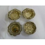Four silver and white metal bonbon dishes