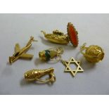 A quantity of gold jewellery (tested 18ct) to include six charms and a ring