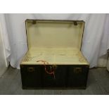 Metal bound steamer trunk, linen lined interior with hinged cover and key