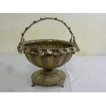 A Continental white metal bowl with pierced leaf chased bowl and border on circular raised base