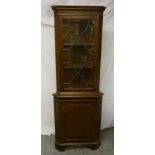 Mahogany glazed corner cabinet on bracket feet