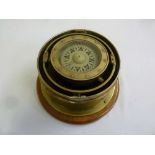 A compass by Henry Browne & Son mounted in brass and on wooden base
