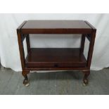 Mahogany tea trolley with ball and claw feet on castors