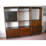 A Danish Rosewood three section wall unit circa 1970, to include shelves, drawers and cupboards with