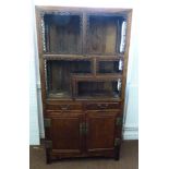 An early 20th century Chinese hardwood display cabinet, rectangular, two drawers above a cupboard