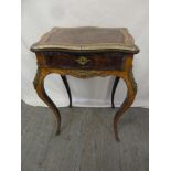 A French tulip wood work table with ormolu mounts on four cabriole legs, original label to base