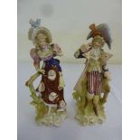 Two Continental porcelain figurines in classical dress - marks to the base A/F