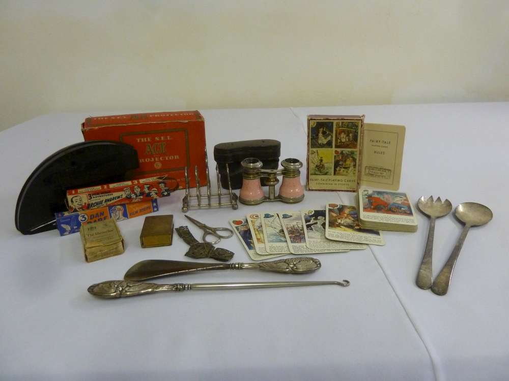 A quantity of collectable items to include opera glasses, salad servers, silver handled button