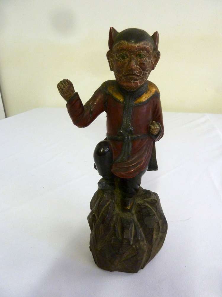 A 19th century Continental painted figurine on naturalistic wooden base - A/F