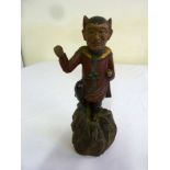 A 19th century Continental painted figurine on naturalistic wooden base - A/F