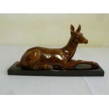 Art Deco style figurine of a glazed ceramic deer, impression marks to base