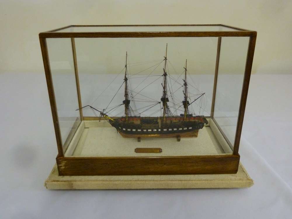 A scale wooden model of the USS Constitution in glazed wooden case A/F