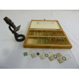 A quantity of miscellaneous prepared slides in fitted case and travel microscope by Baker
