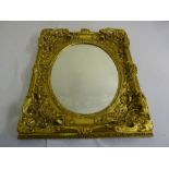 Rectangular gilt framed oval mirror