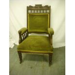An Edwardian oak upholstered ladies chair