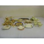 A quantity of Art Deco porcelain to include sandwich plates and a butter dish