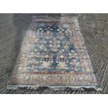 A Persian wool carpet blue ground with mogul design and floral border - 218 x 152cm