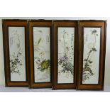 Four Chinese porcelain panels of flowers and insects in hardwood frames - 92 x 36.5cm