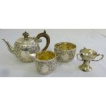 A Victorian silver three piece bachelor teaset, London 1892 and a miniature silver trophy cup