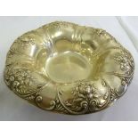 An American white metal fruit bowl shaped circular, chased with flowers and leaves