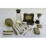 A quantity of silver to include a desk calendar, two fruit knives, a cigarette case, a vesta case,