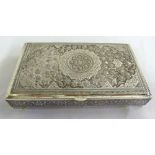 Persian white metal cigarette box, profusely decorated with flowers and leaves with hinged cover