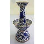 A 19th century Chinese blue and white candlestick of tapering tubular form