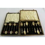 Two cased sets of silver coffee and teaspoons