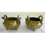 Pair of Chinese brass sensors with dragon handles on three feet, marks to the base ? one A/F