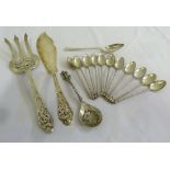 A quantity of silver and white metal flatware to include fish servers, eleven coffee spoons and