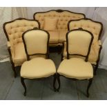A mahogany upholstered salon suite comprising a two seater settle, two fauteuils and a pair of