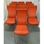 Ten faux red leather and chrome dining chairs