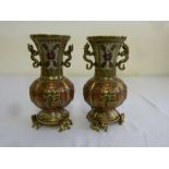A pair of Chinese 19th century cloisonn‚ vases with dragon handles on raised bases with dragon feet