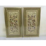 A pair of Oriental embroidered panels depicting figures, foliage and animals - 63.5 x 33cm