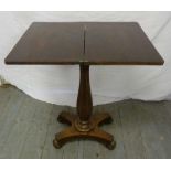 Georgian mahogany games table on pedestal base with four scroll feet and hinged top