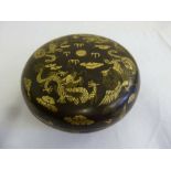Chinese papier mache circular black lacquered covered box with gilt dragon decorations