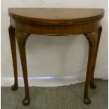 Waring and Gillow mahogany demilune card table on four cabriole legs, label to base