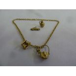 9ct gold chain with four charms, approx 10.1g