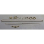 A quantity of 9ct gold jewellery to include seven rings, two chains and a brooch, approx 22g