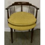 Mahogany armchair with upholstered seat on cylindrical tapering legs