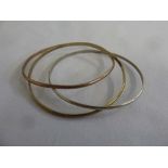 Three 9ct gold bangles, approx 24.5g