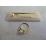 9ct gold ring set with a cultured pearl and a 9ct gold tie pin set with a cultured pearl