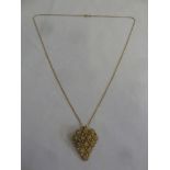 Gold chain and a pendant set with seed pearls (tested 18ct), approx 10g