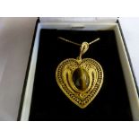 18ct gold chain with a heart shaped pendant set with tigers eye, approx total weight 12g