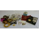 A quantity of costume jewellery to include brooches, necklaces and bracelets