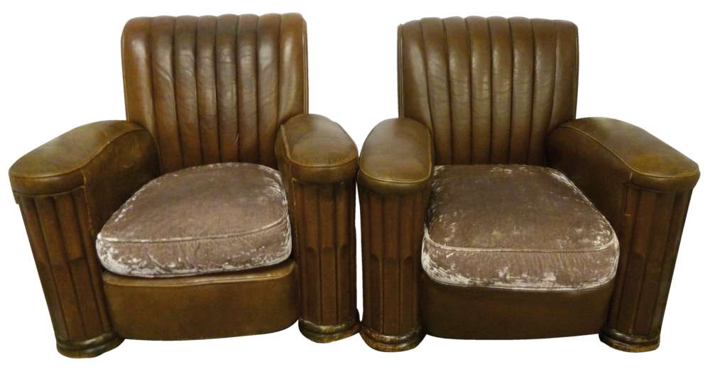 A pair of Art Deco leather armchairs with upholstered seats on original castors